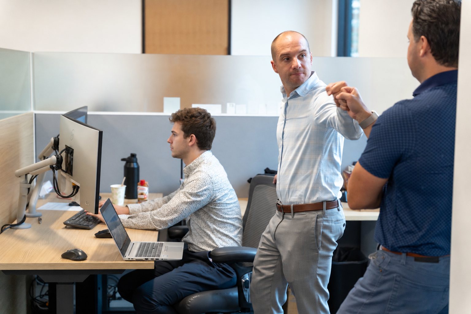 Kyle working with a client in their office